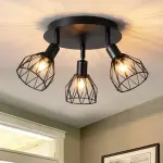 Kitchen lighting fixtures are ceiling mounted, with a three way rotating black iron lampshade
